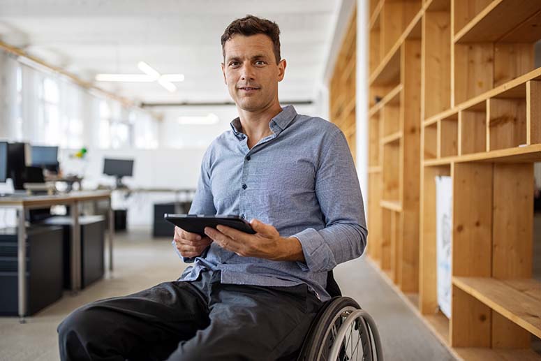 Man in wheelchair in office
